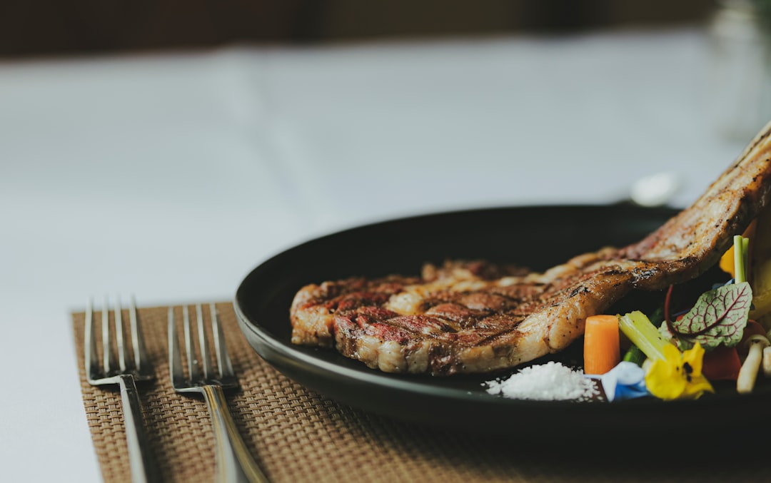 cooked-food-on-black-plate-syeo8f-gx6c