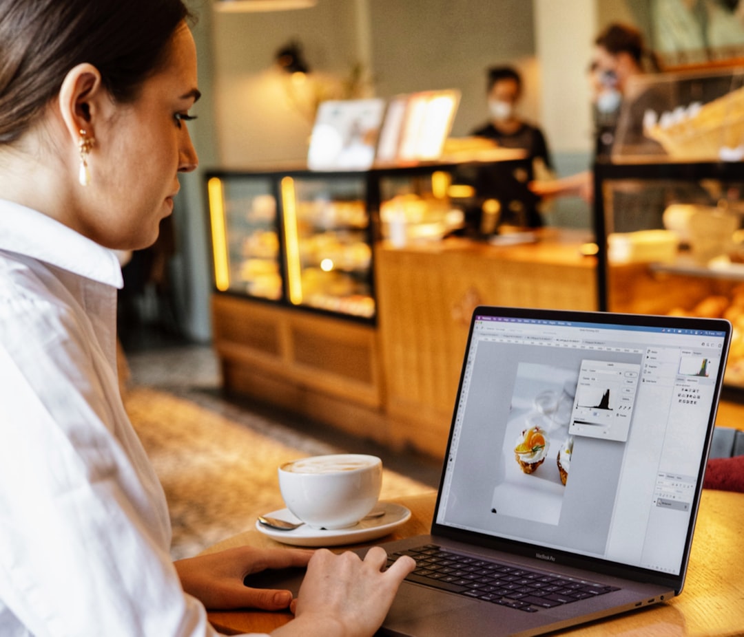 woman work life balance front is laptop at cafe